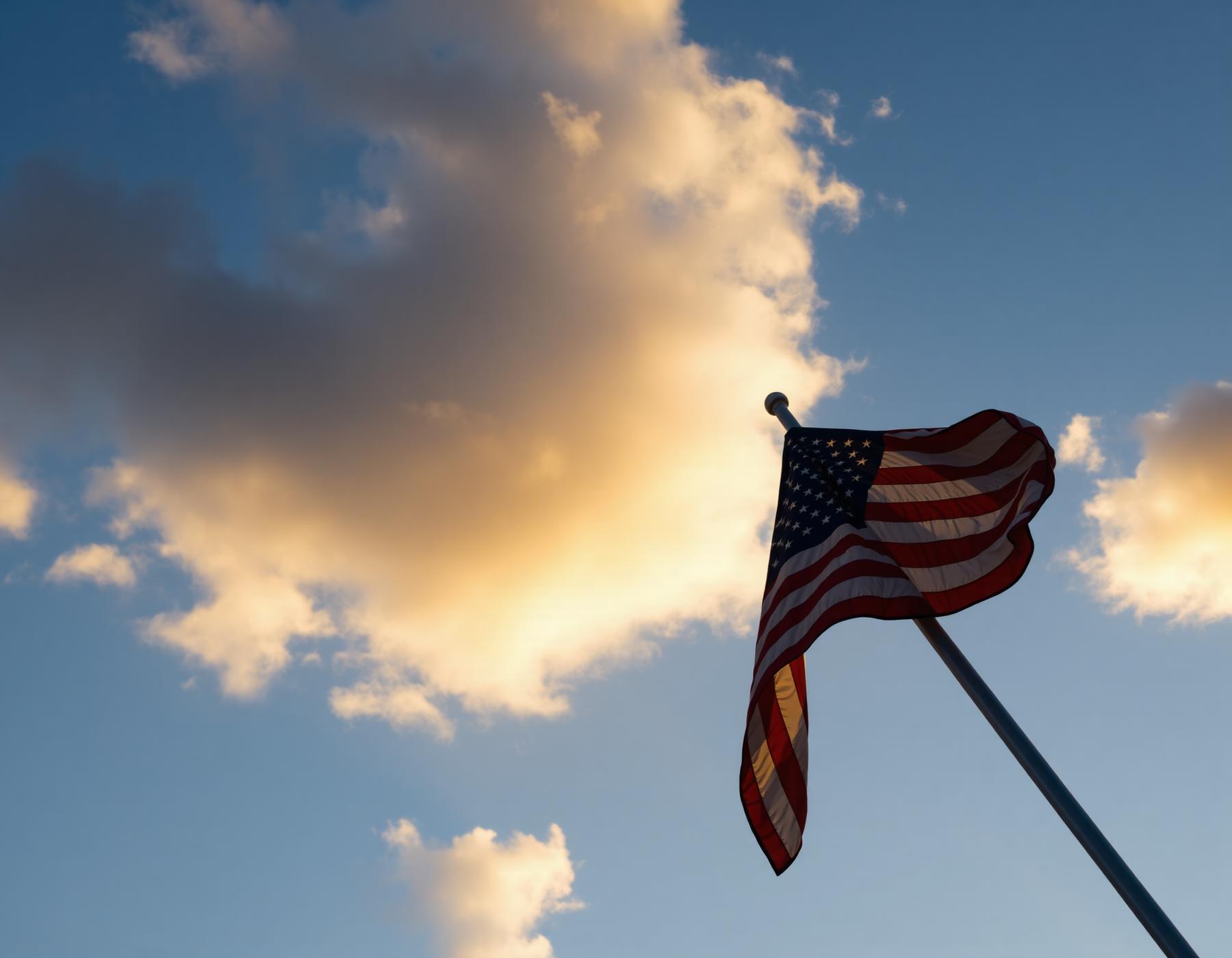 American flag against a dramatic sky
